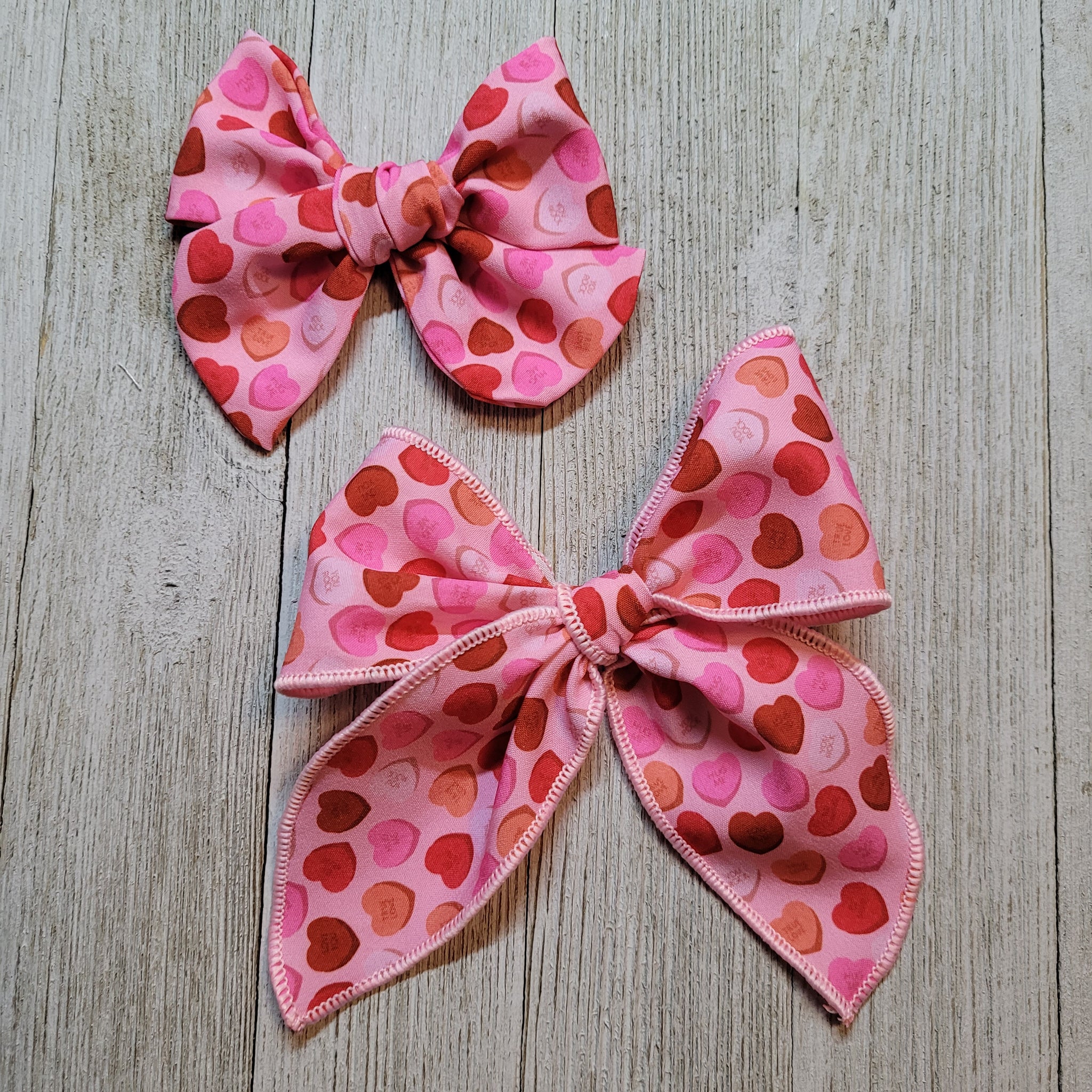 3 inch Bow or 5 inch heart Bow either clip or nylon Headband