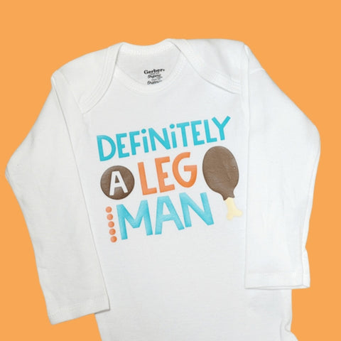 'Definitely a leg man' white onesie 6/9m long sleeve